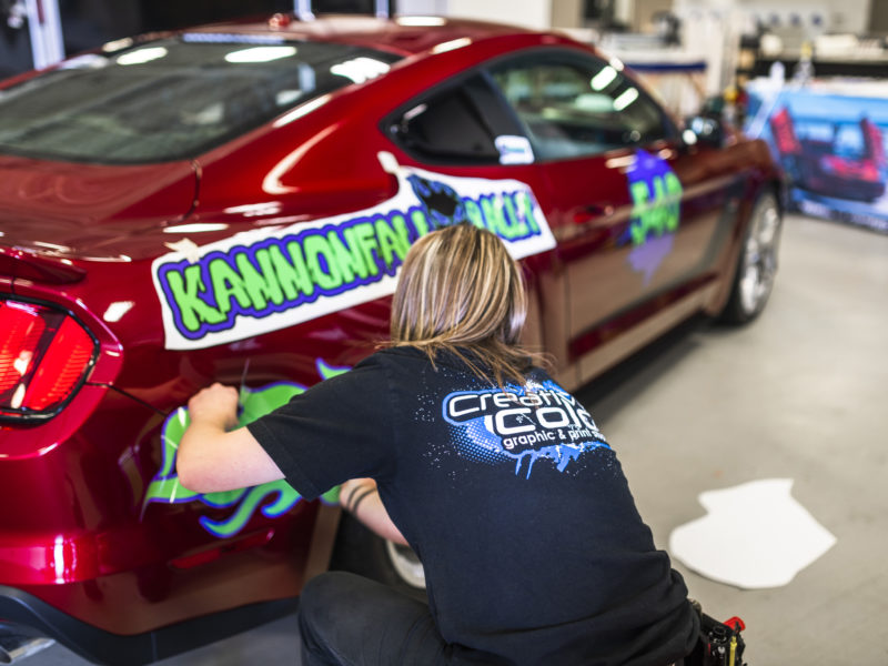 vehicle rally wraps being installed