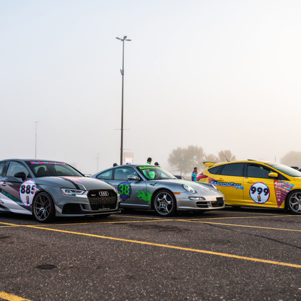 Vehicle Vinyl Wraps, rally wraps row of cars from side